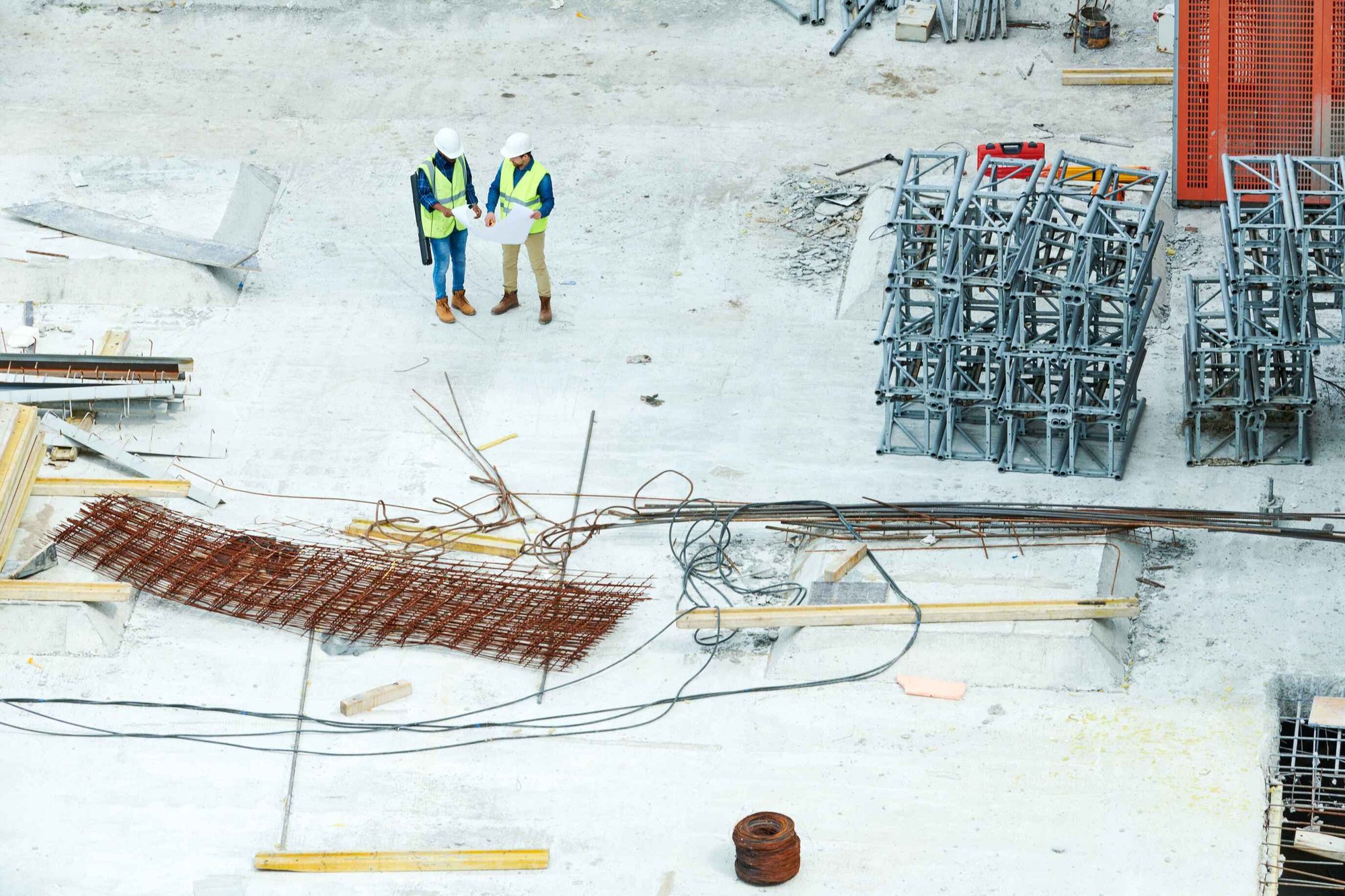 Two Government Construction Workers Onsite By Materials