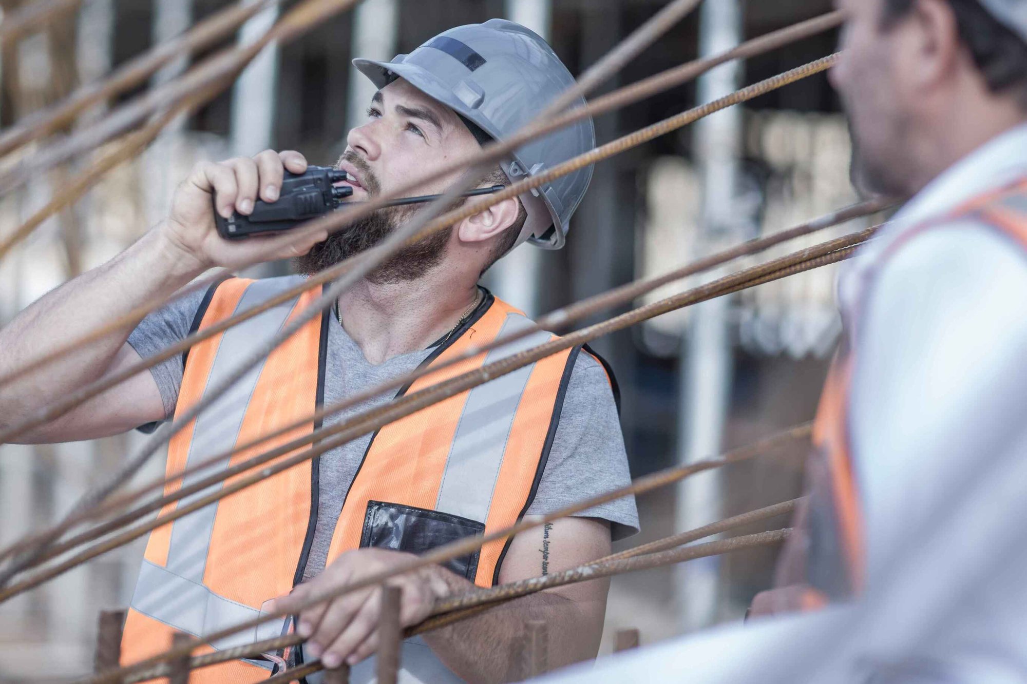 Government Contractors Working Onsite By Rebar