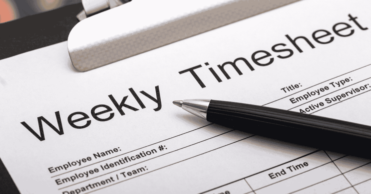 Pen on top of printed weekly time sheet