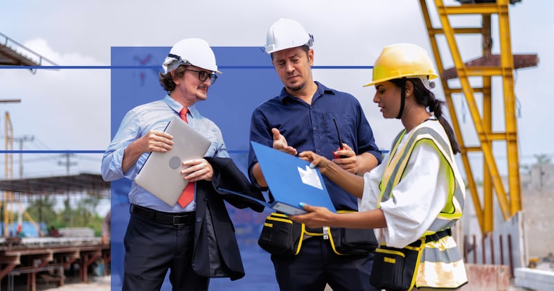 contractors looking at paperwork on site.