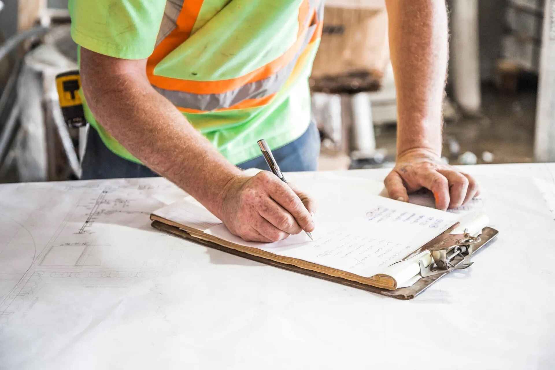 Certified Payroll Prevailing Wage Worker Taking Notes