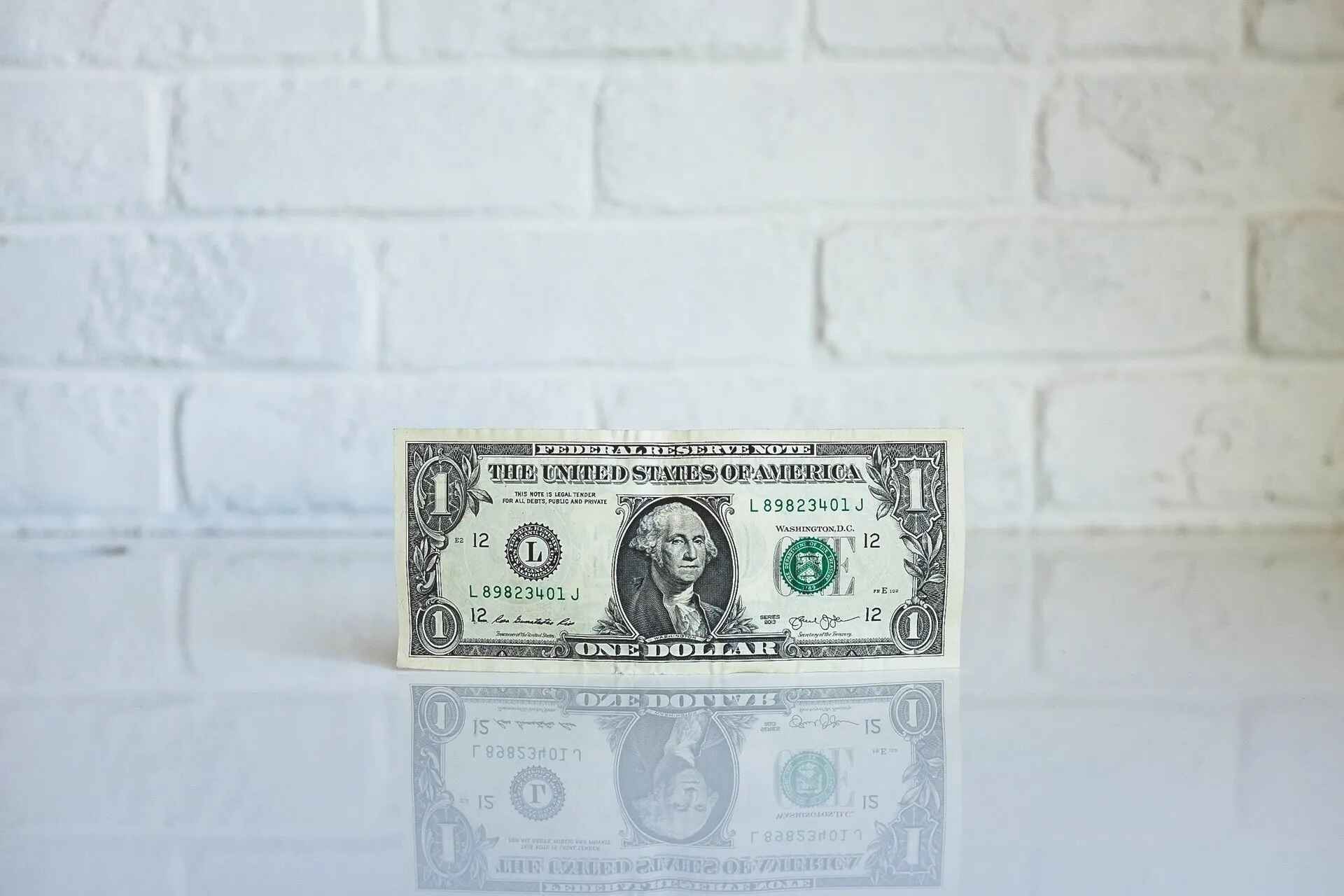 Dollar on Brick Background