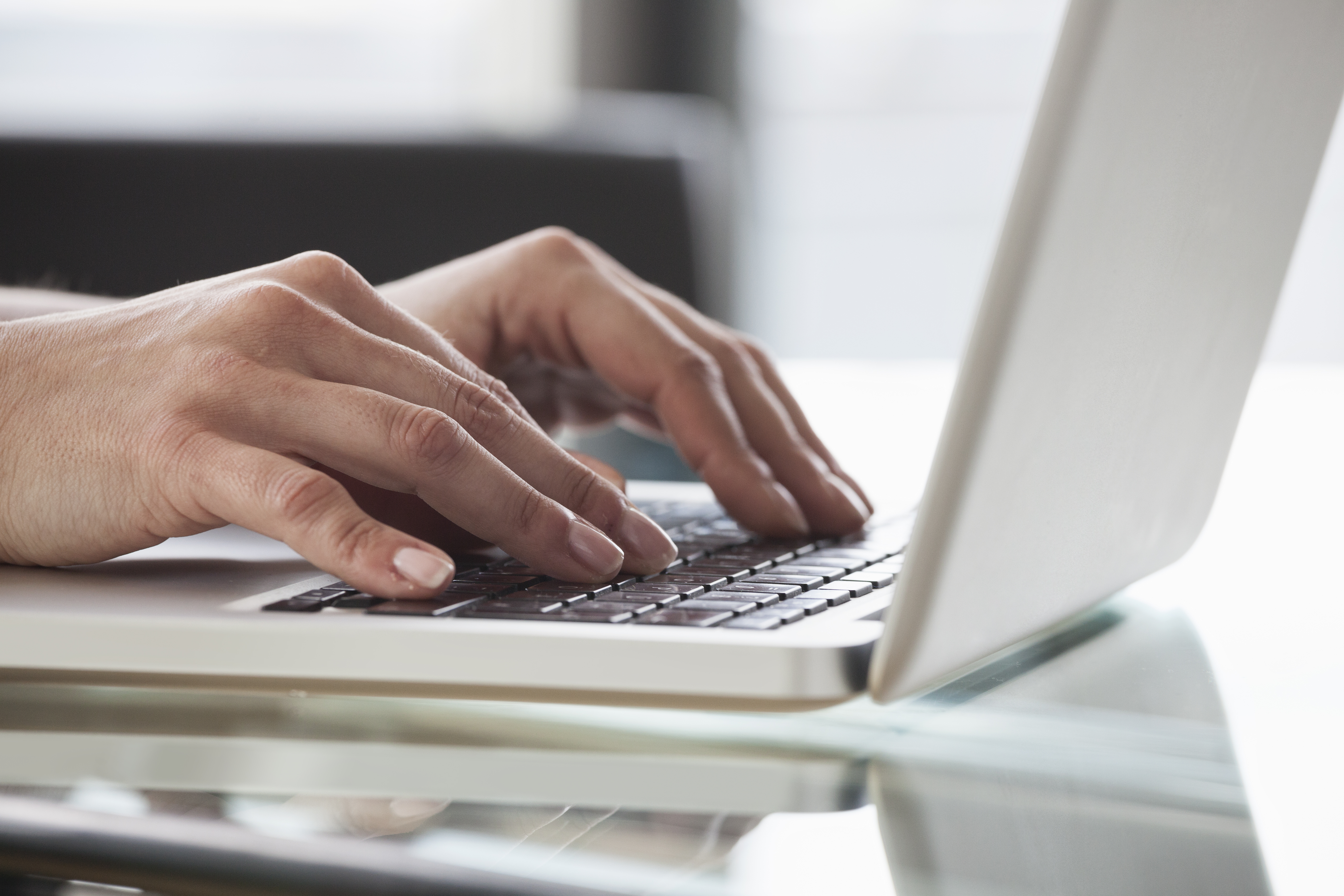 Hands using a laptop