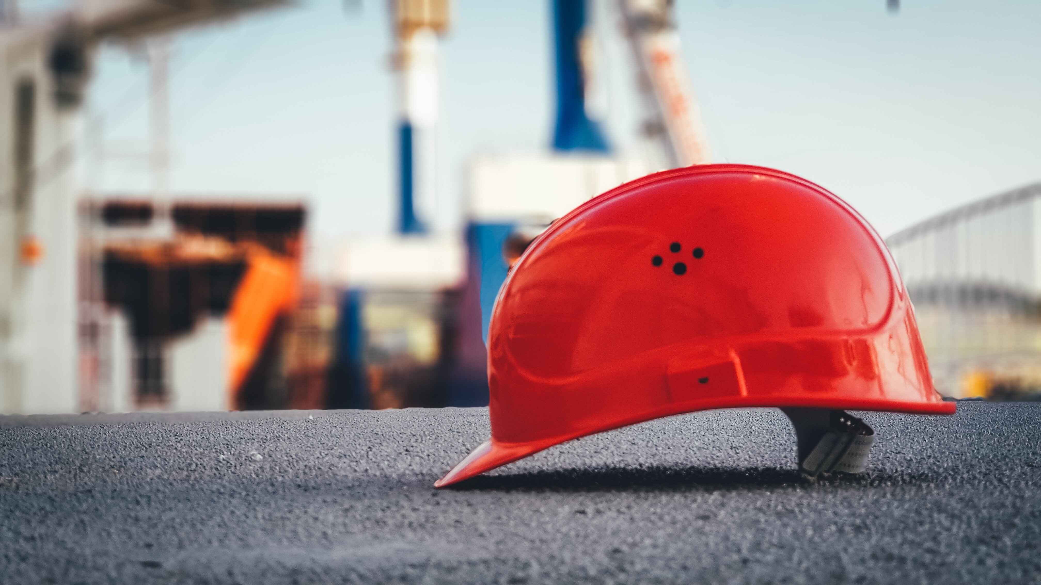 Red construction hat on ground